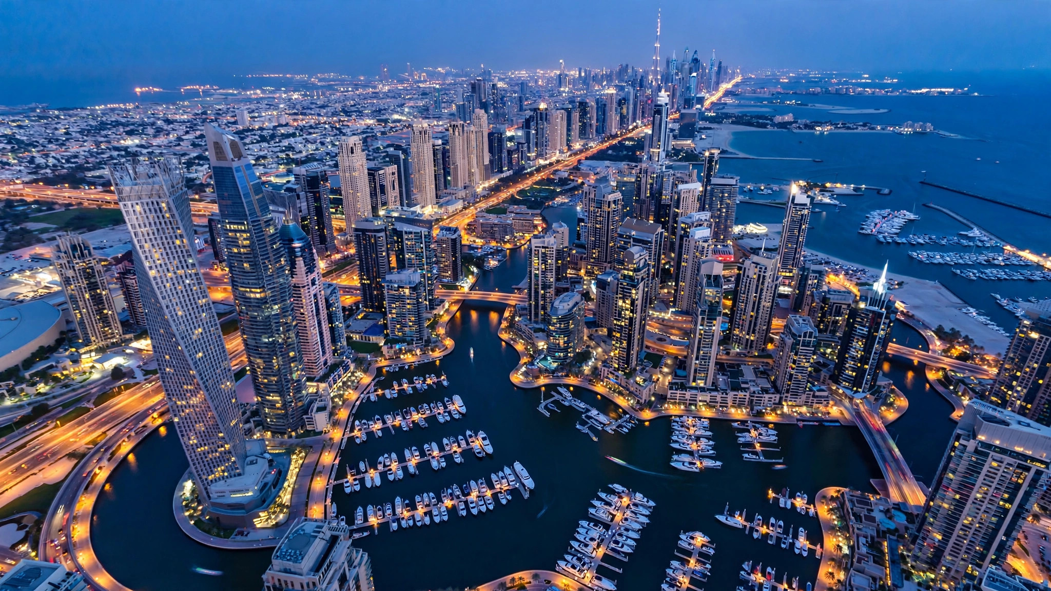 Dubai Shopping Festival Travel Guide: Dates, Malls and Deals Aerial Dubai skyline and marina at blue hour with city lights